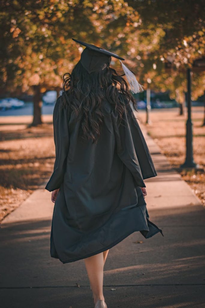 Best Thesis Writing Services in India 2 - LiftStrong Woman in Black Long Sleeve Dress Standing on Brown Concrete Pathway