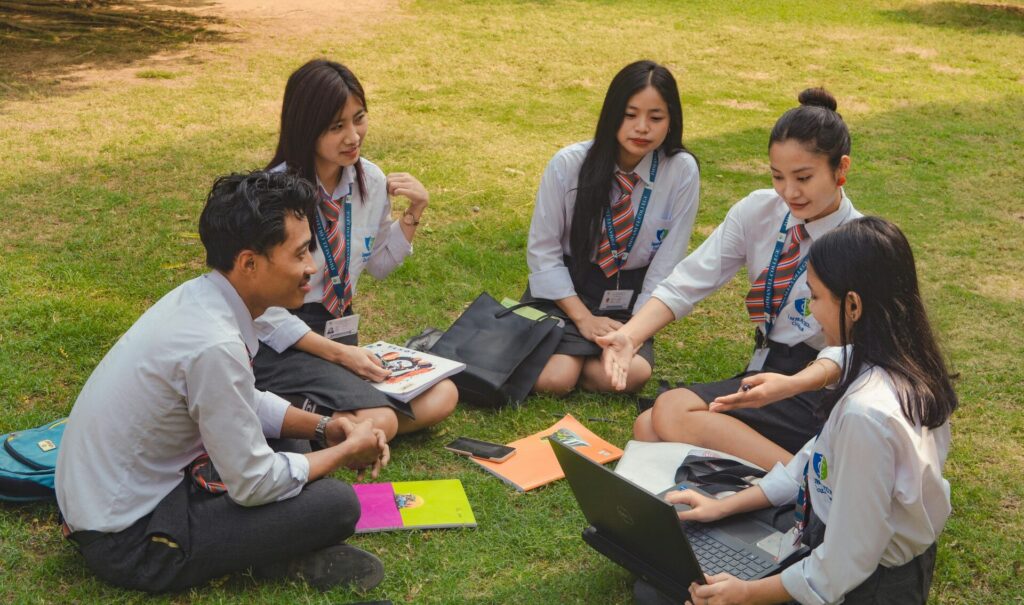 A group of college students studying together on a sunny day in Dimapur, India.